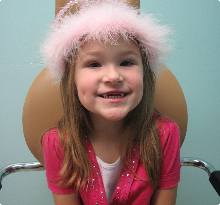 Girl with fuzzy pink hat